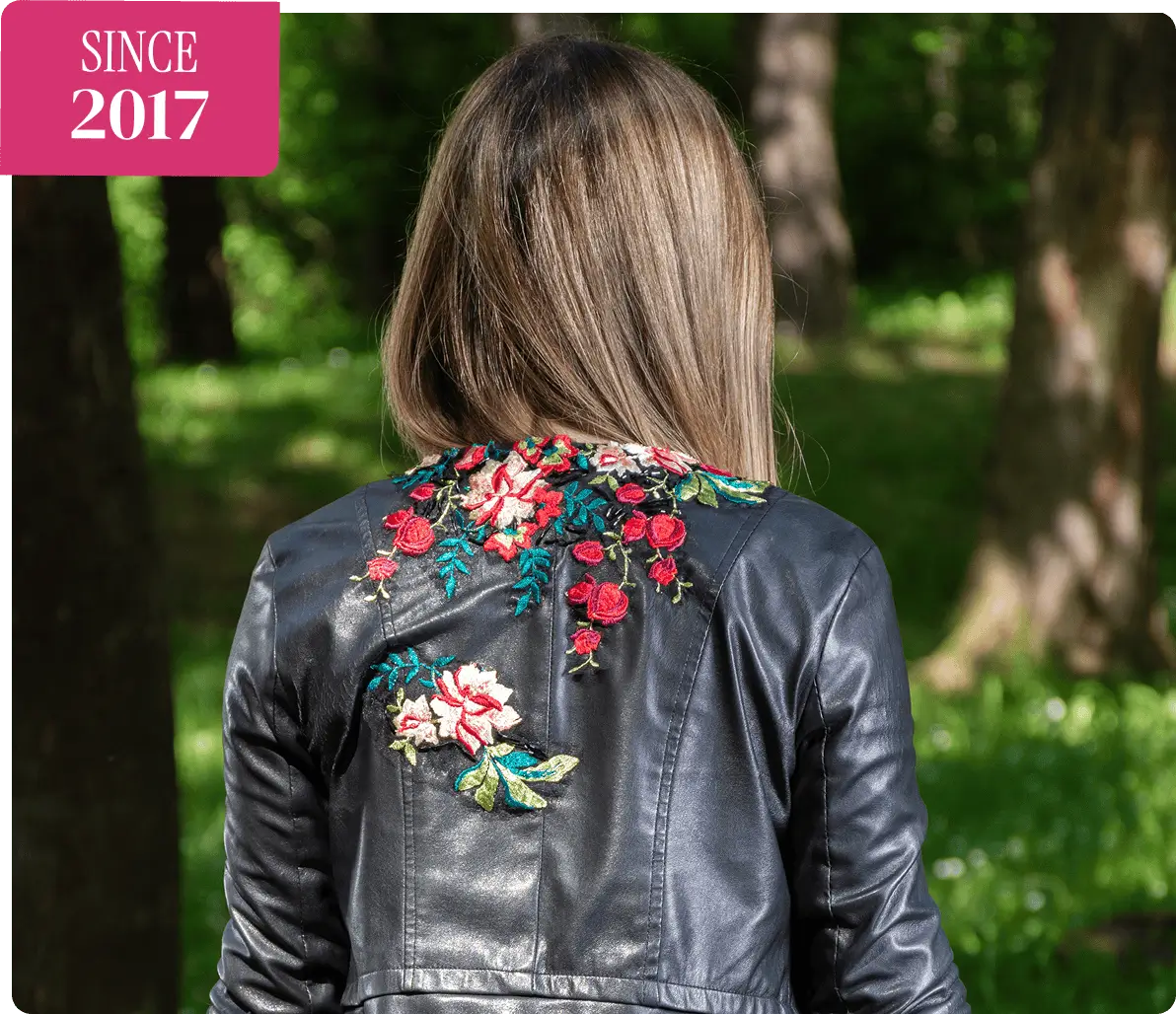 Back view of embroidered leather jacket.